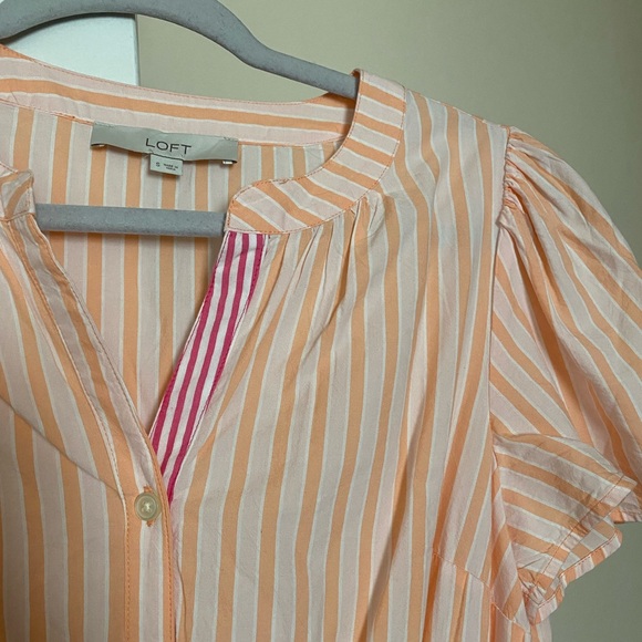 A dress with stripes. I am 5’2 and it is a midi dress on me. - Picture 3 of 4